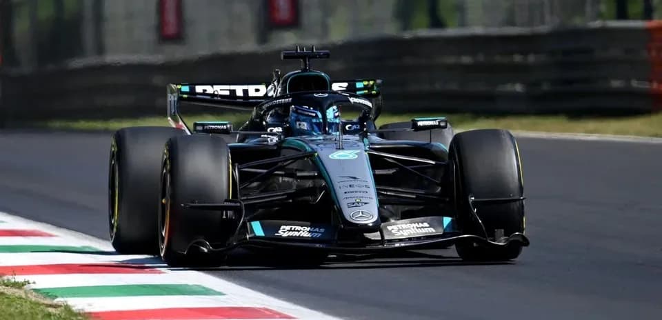 Mercedes Formula 1 car driving on racetrack