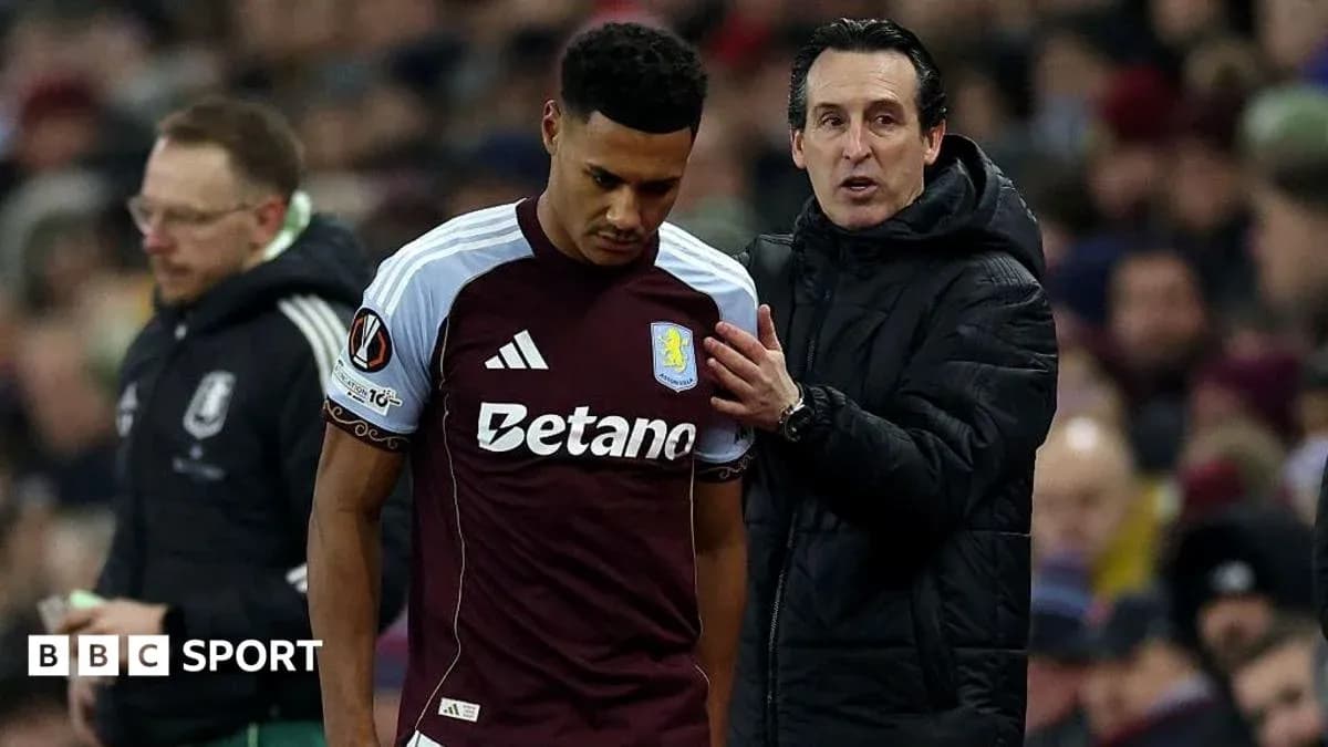 Aston Villa player receiving instructions from manager