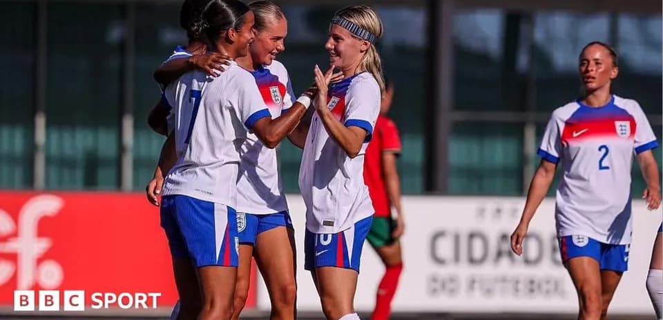 England women's team celebrating a goal on field
