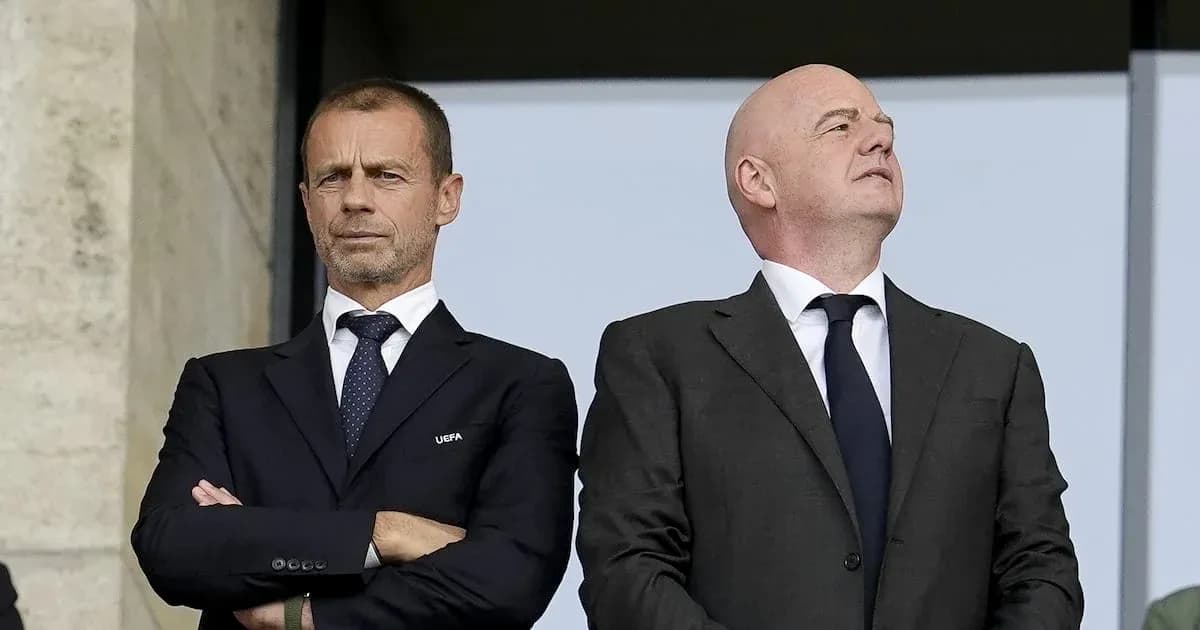 Two officials observing an event from a balcony