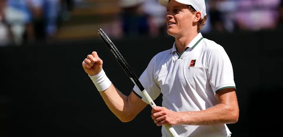 Tennis player celebrating during match at Wimbledon