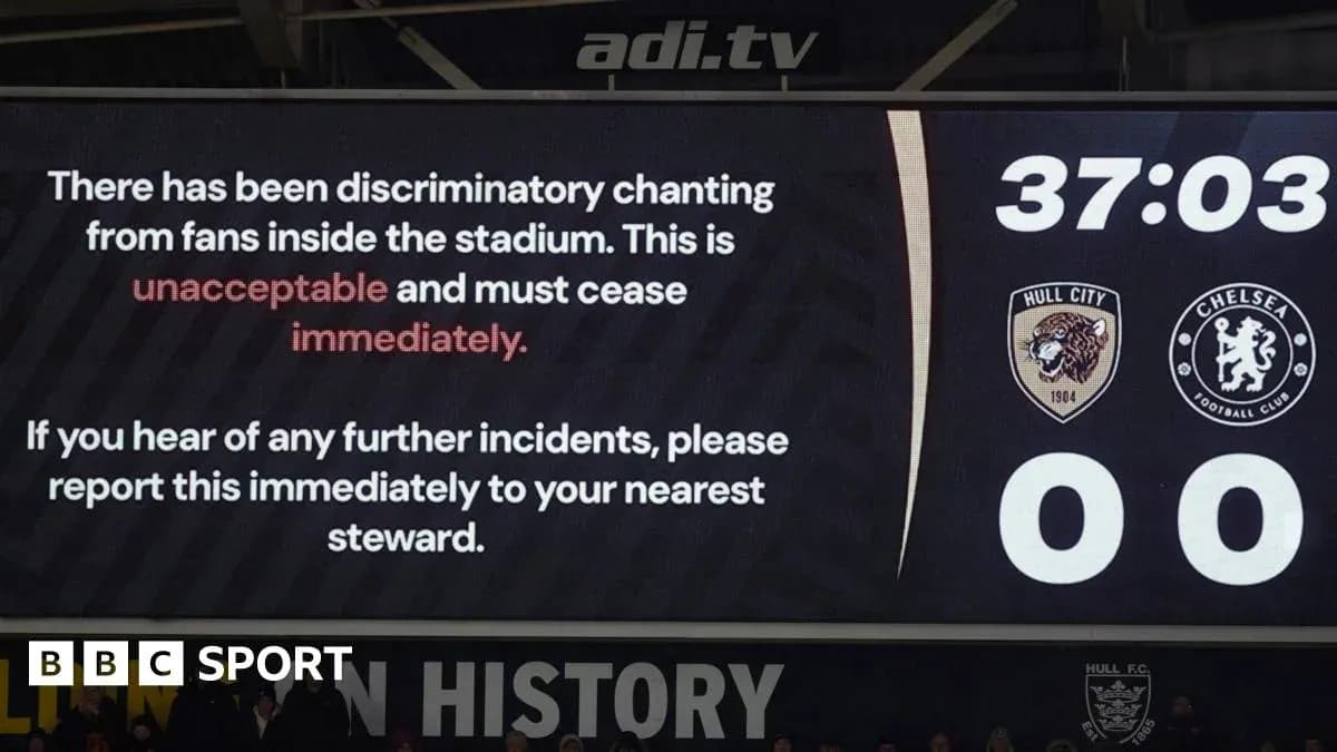 Stadium screen displaying message about fan behavior