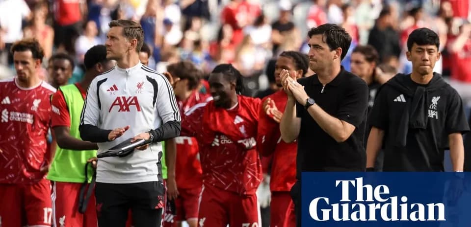 Liverpool players and staff applauding fans after match