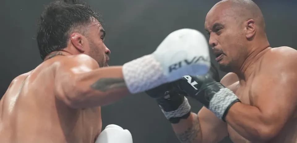 Boxers exchanging punches in a boxing match
