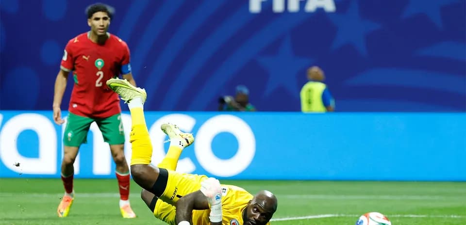 Goalkeeper diving for the ball during a match