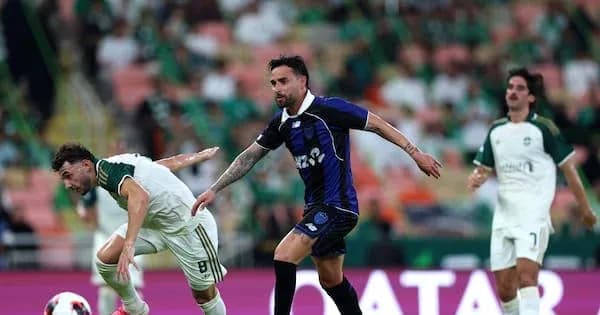 Two players competing for the ball during match