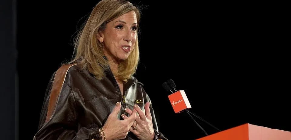 Speaker addressing audience at WNBA event