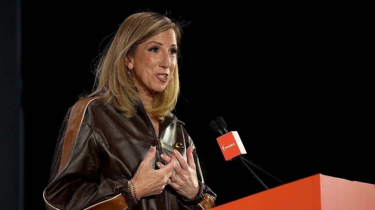 Speaker addressing audience at WNBA event
