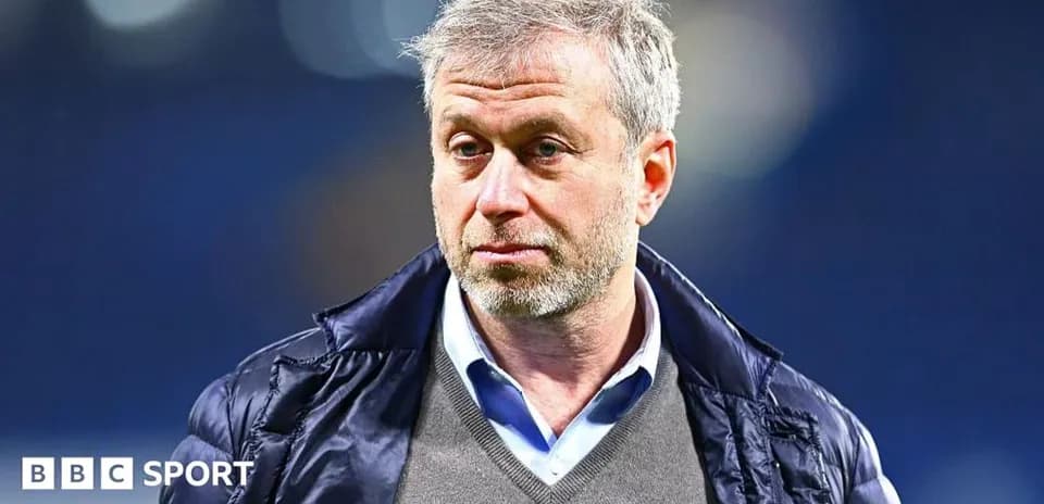 Man in a jacket during a sports event