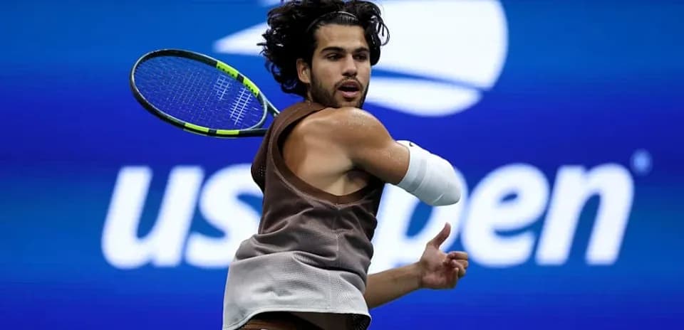 Tennis player hitting a backhand at US Open