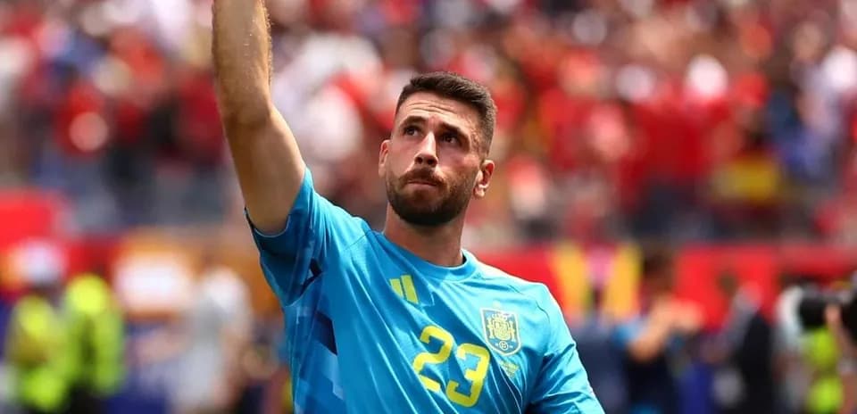 Goalkeeper celebrating with raised hand during match