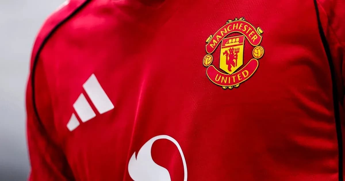 Manchester United logo on red jersey