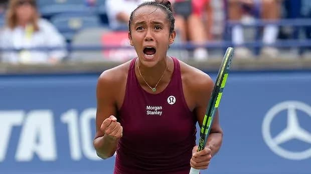 Tennis player celebrating victory on the court