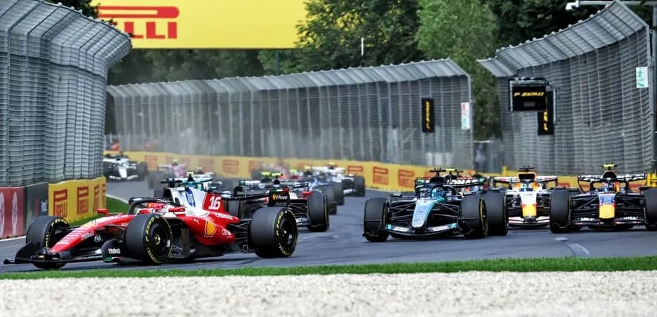 Formula 1 cars racing on track during competition