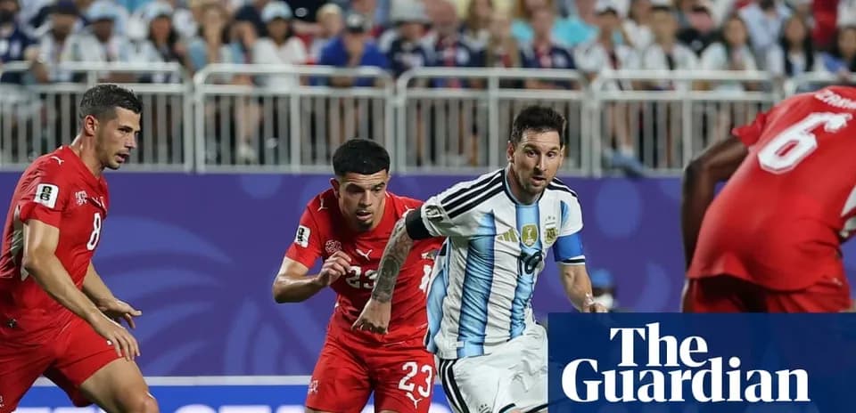 Messi dribbling past defenders during match