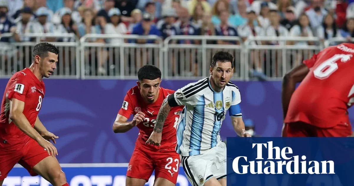 Messi dribbling past defenders during match