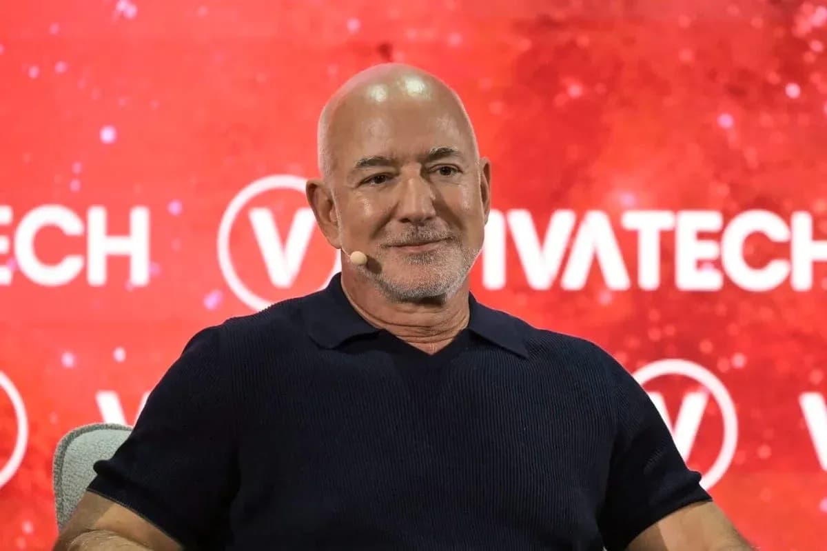 Speaker at VivaTech event with red backdrop