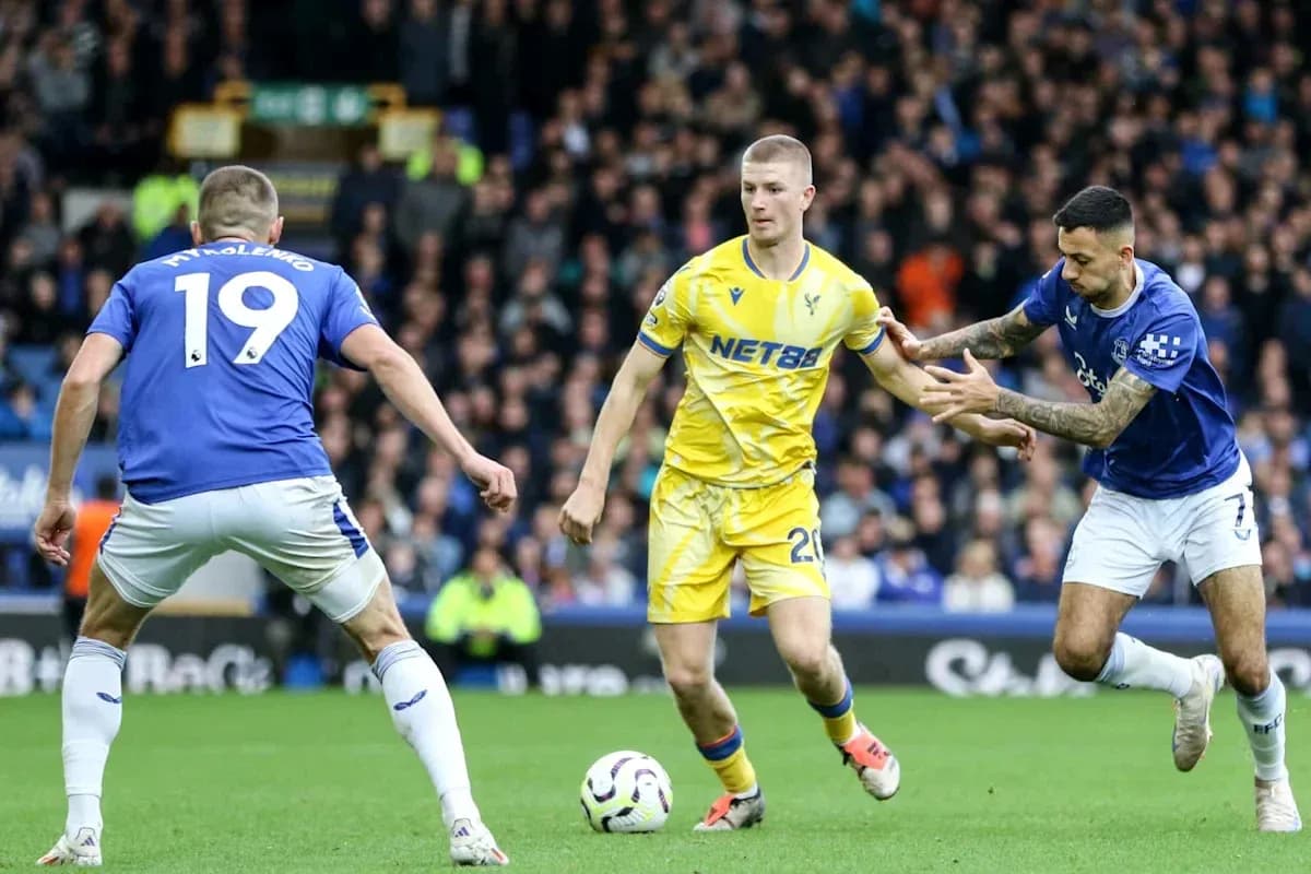 Three players competing for the ball during match