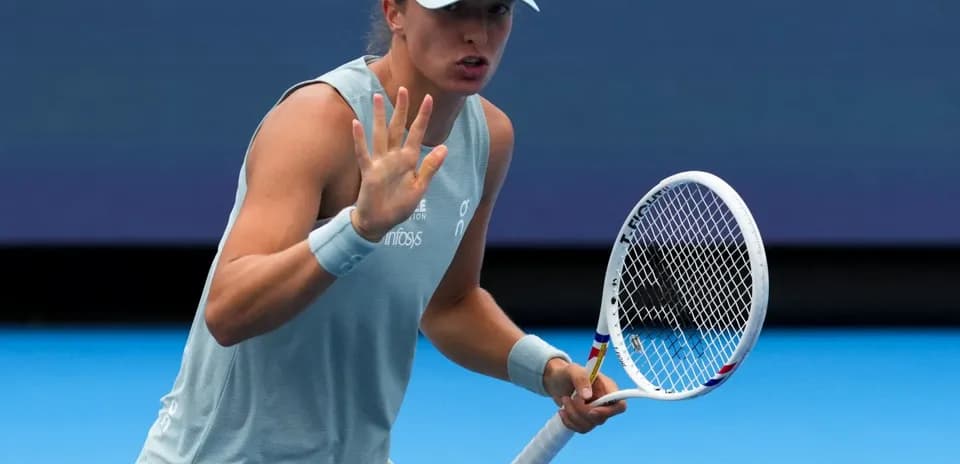 Tennis player gesturing during a match on court