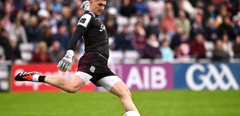 Goalkeeper kicking the ball during match action