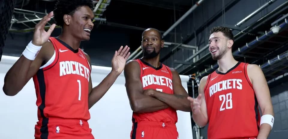 Three Houston Rockets players posing for photo