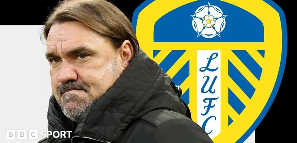 Coach in front of Leeds United logo