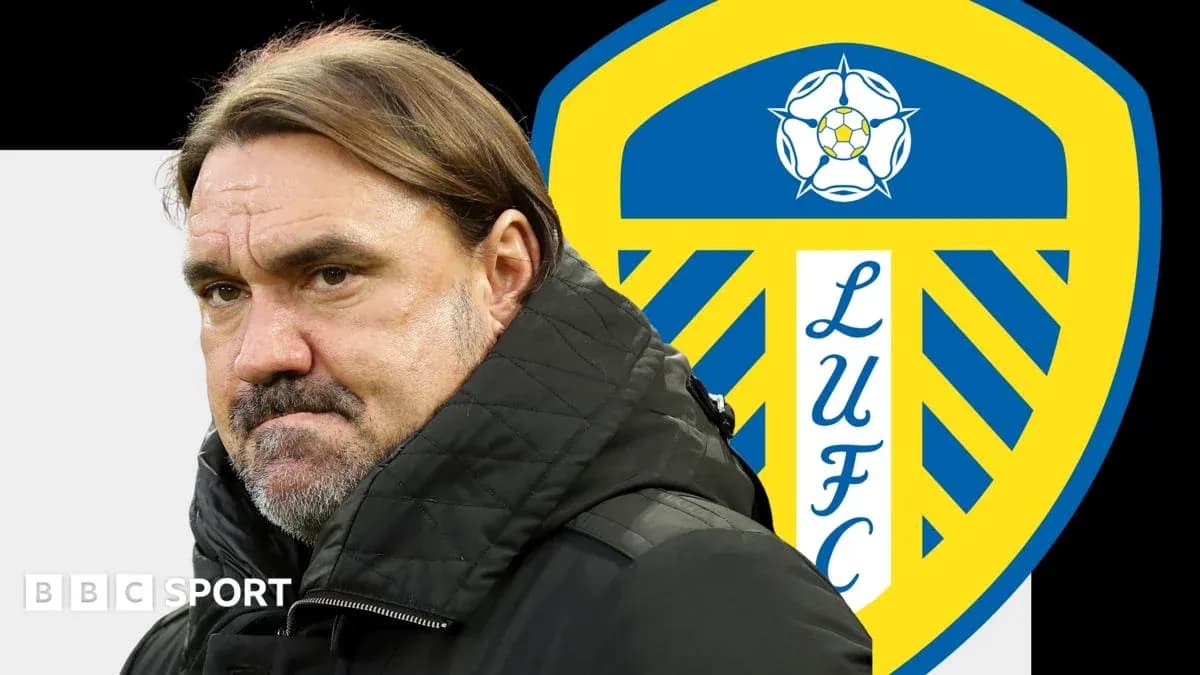 Coach in front of Leeds United logo