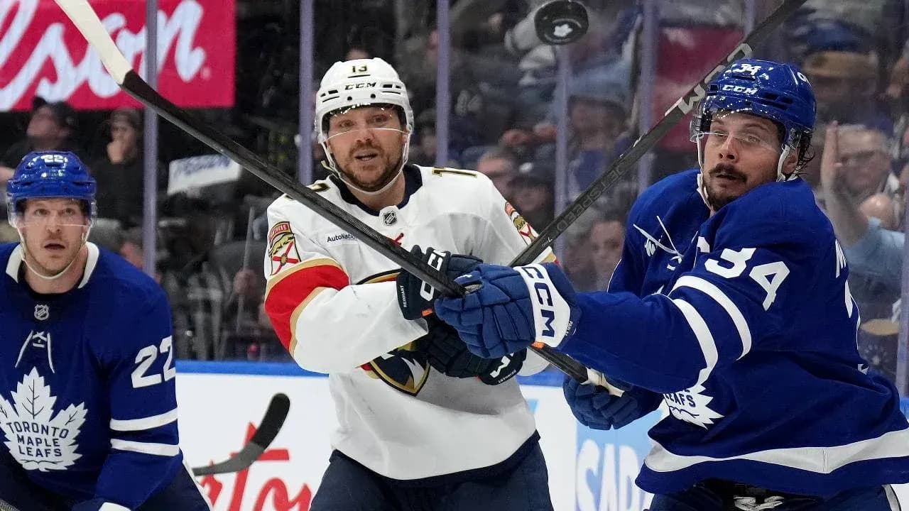 Hockey players battling for puck during match