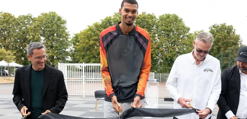 Ceremony for opening new basketball court with attendees