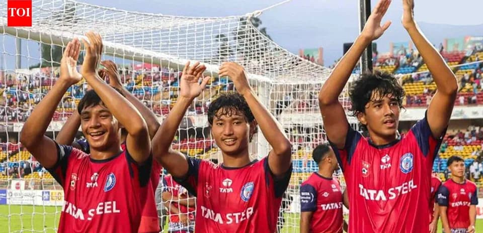 U19 players celebrating in front of fans
