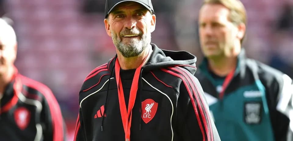 Liverpool manager on pitch before a match