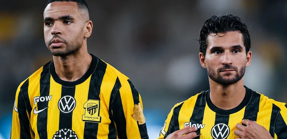 Ittihad Club players in yellow and black uniforms
