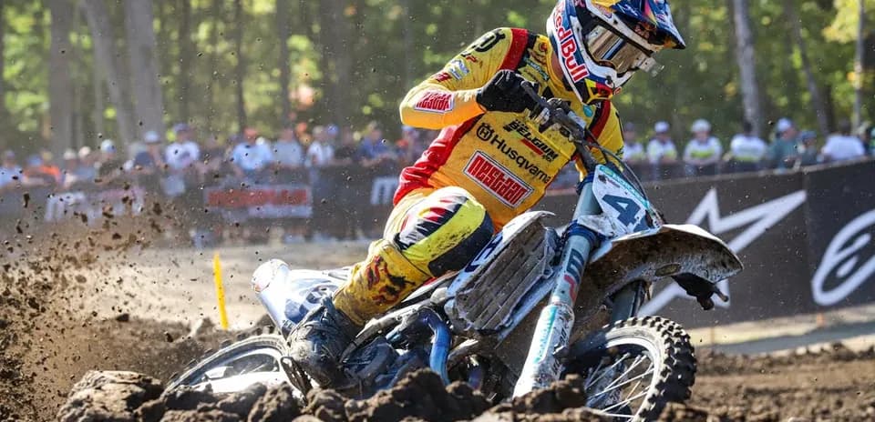 Motocross rider navigating a dirt track