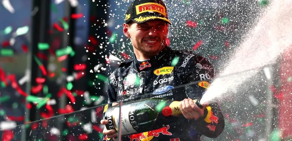 Max Verstappen celebrating with champagne on podium