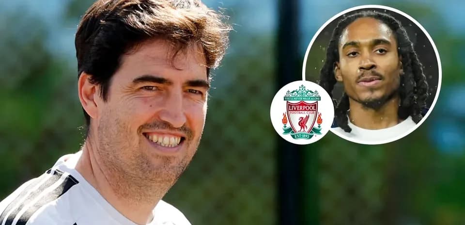 Liverpool coach smiling during training session