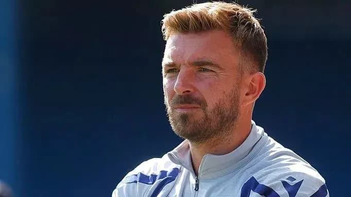 Football coach observing training session outdoors