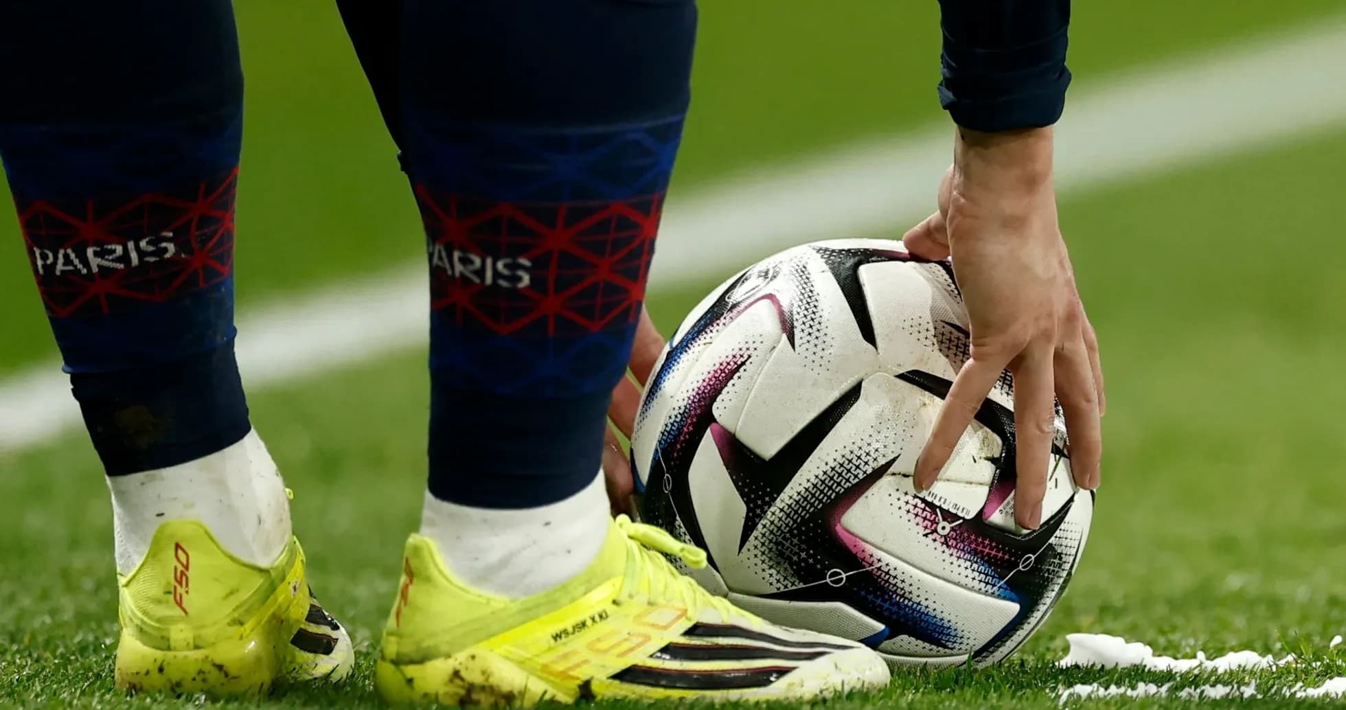 Player preparing to kick ball on field