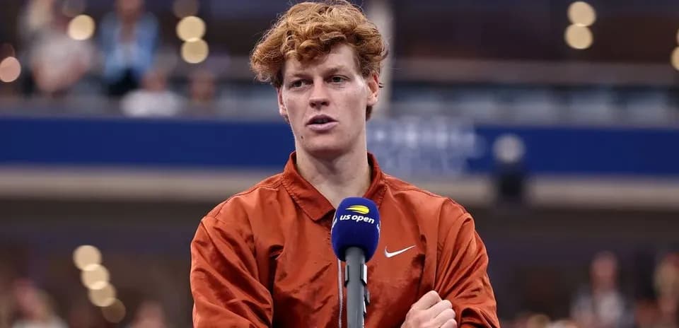 Tennis player speaking at press conference podium