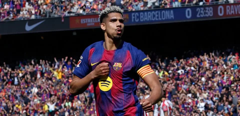 Barcelona player celebrating goal in front of fans