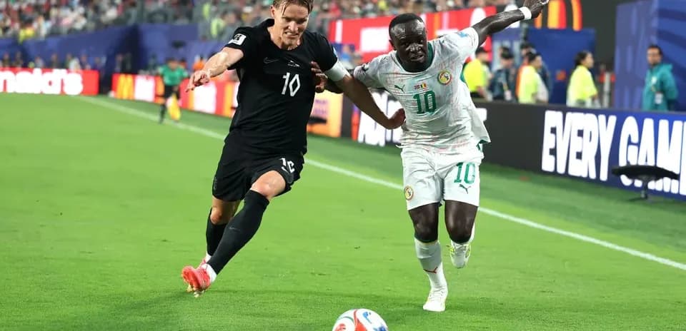 Two players competing for the ball during match