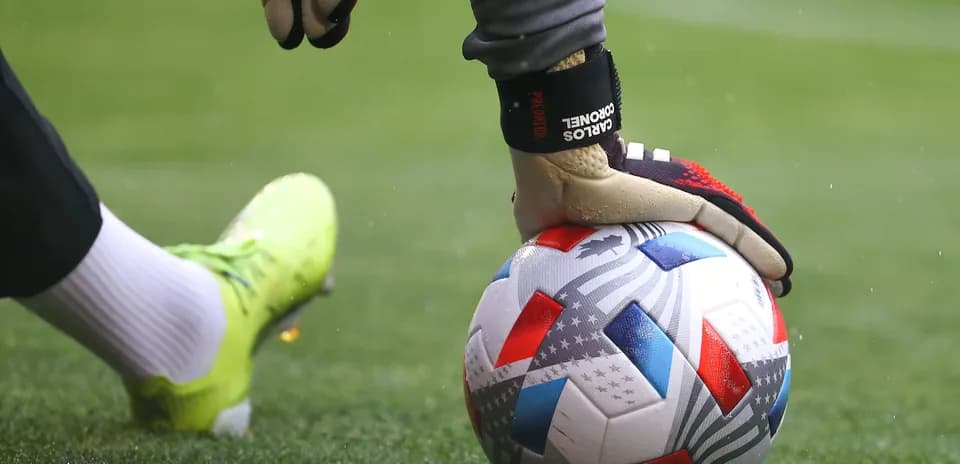 Goalkeeper placing ball on the ground