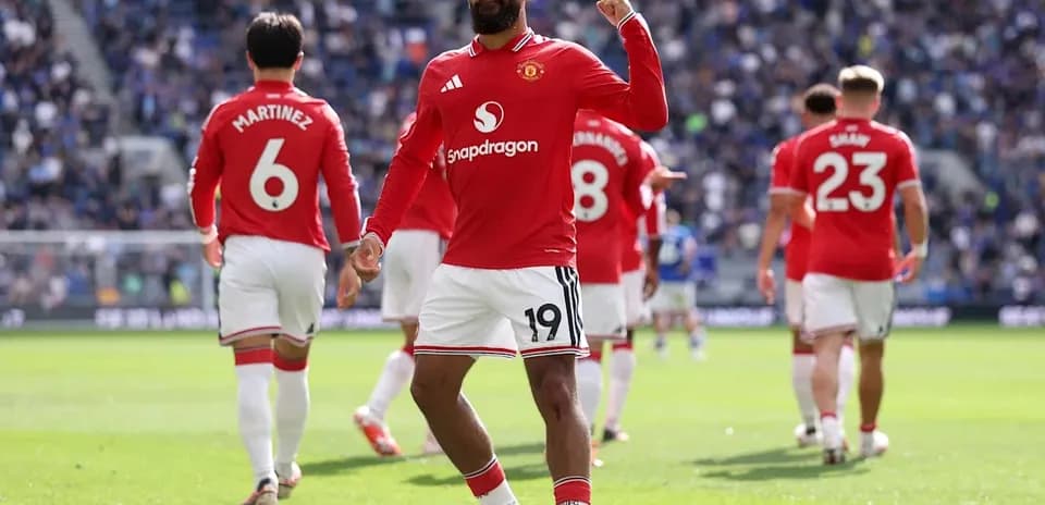 Manchester United player celebrating a goal on pitch