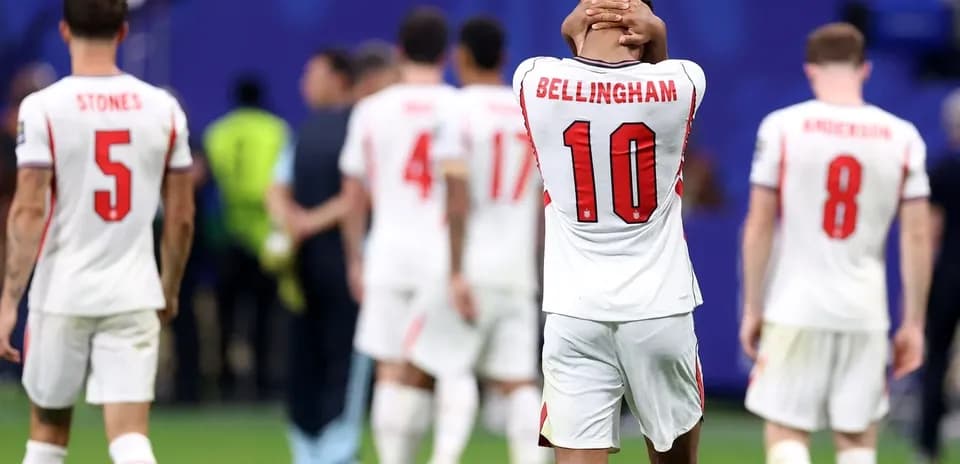 England players walking off the pitch after loss