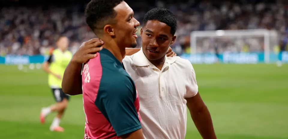 Two players interacting on the field before a match