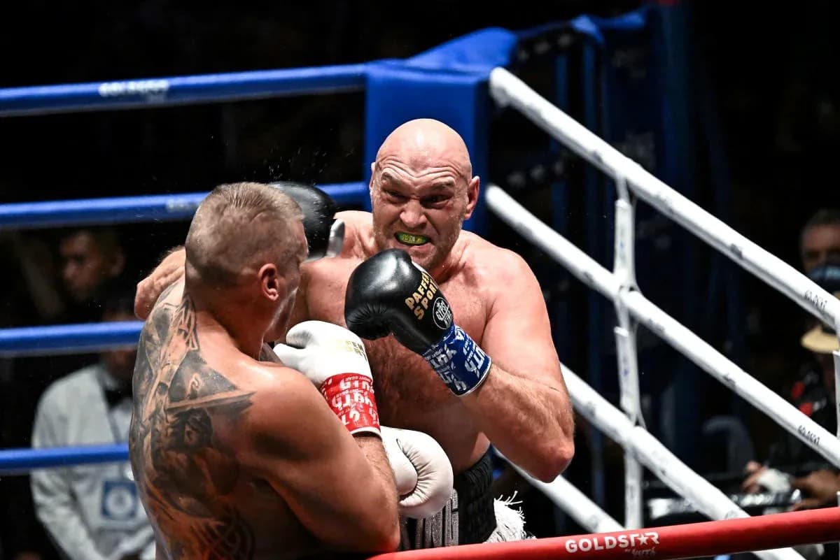 Boxers exchanging punches in the ring