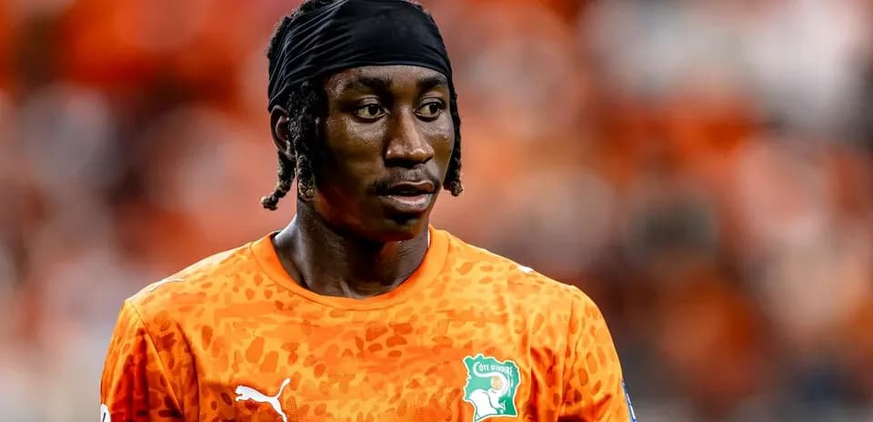 Goalkeeper wearing orange jersey during match