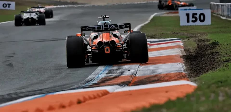 Formula 1 car navigating a turn on track