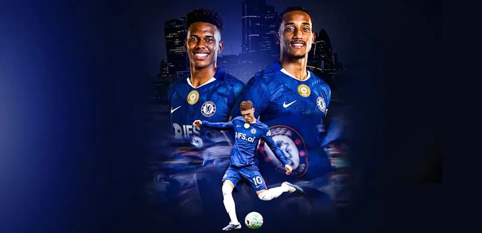Chelsea players posing in team jerseys