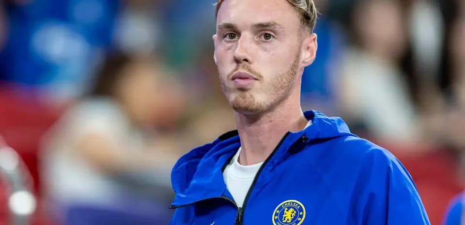 Player in Chelsea jacket during match preparations
