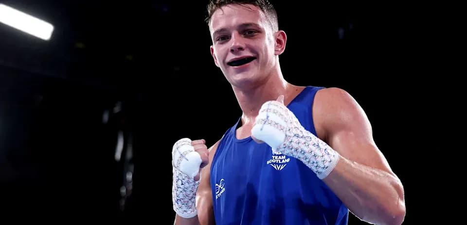 Boxer celebrating victory in blue uniform